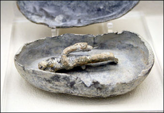 curse doll with inscriptioon