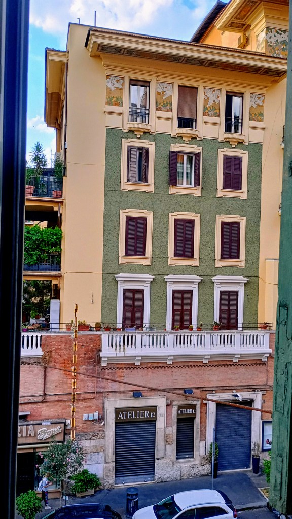Photograph of a building in Rome with many windows

