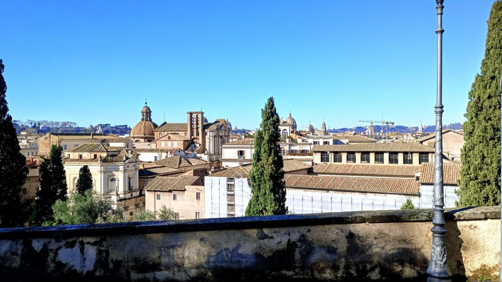 photo of view of Rome's roof and cypress trees