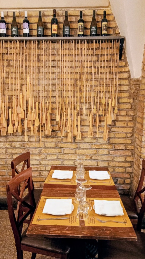 photo wall decor made with twine and wooden utensils