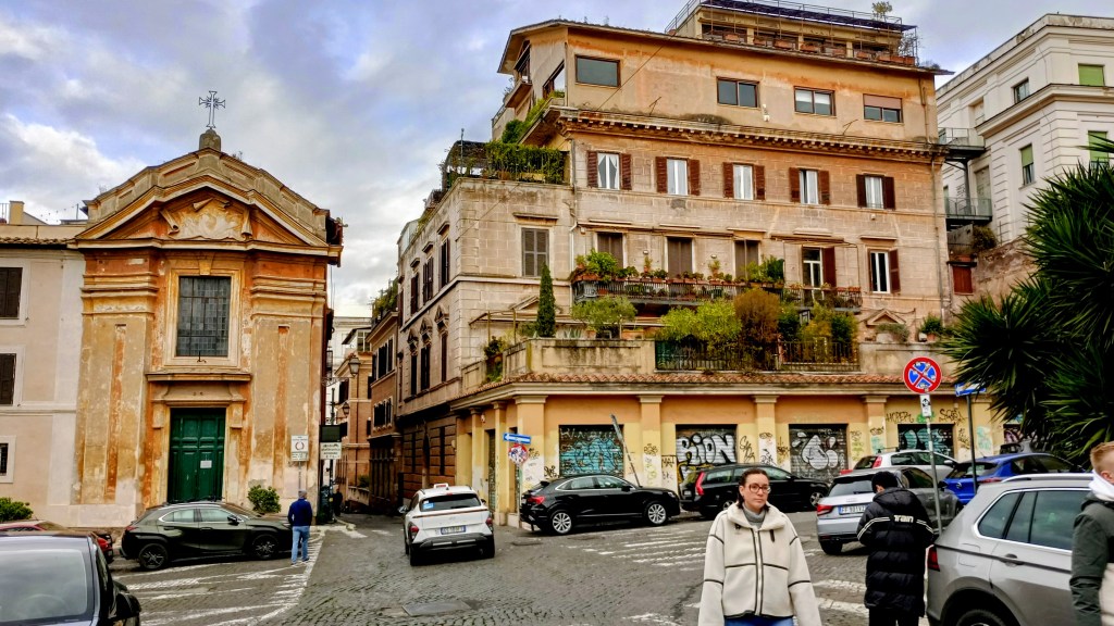 foto of a little church and a big building with a jungled terrace
