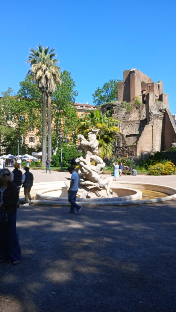 photo of Piazza Vittorio, water fountain and people