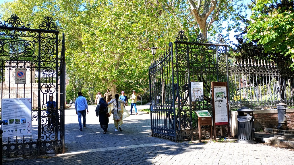 photo of Piazza Vittorio, entrance to the Nicola Calipari Garden with gate and tree
