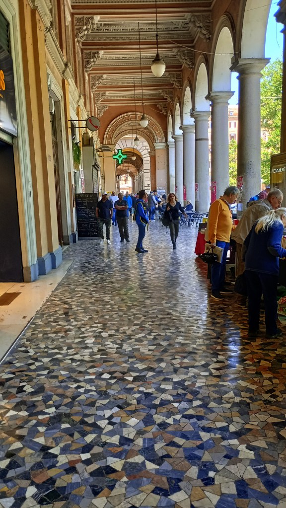 photo of Piazza Vittorio, portico with people