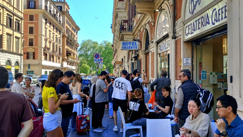 young people outside a pastry shop